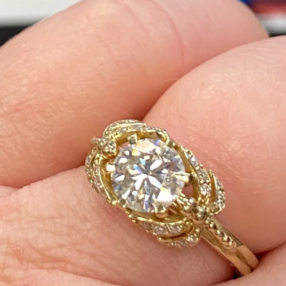10kt yellow gold and moissanite dragonfly ring.